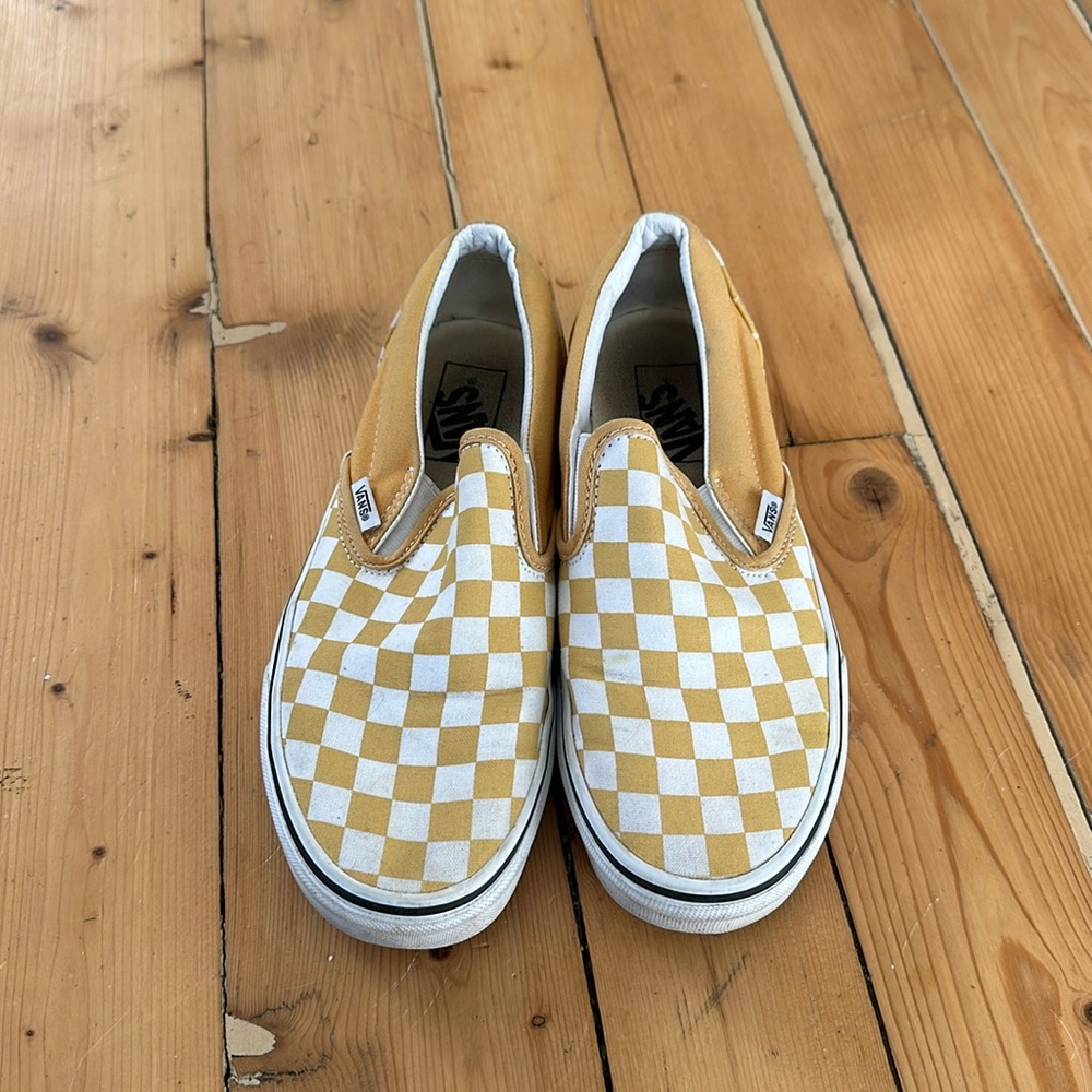 Yellow checkered Vans slip ons